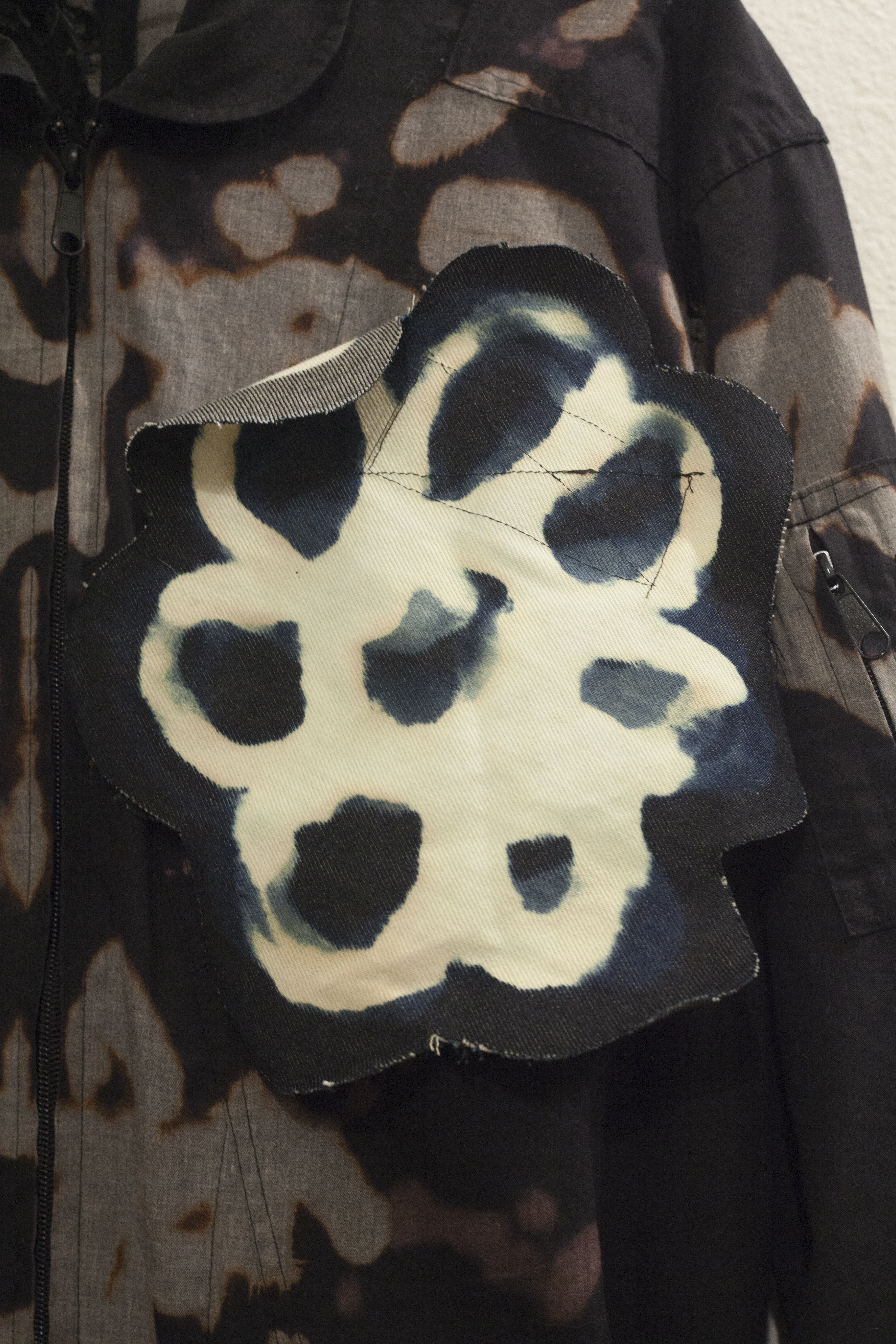 Detail of a  bleached denim flower patch